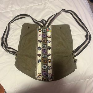 A backpack with pins